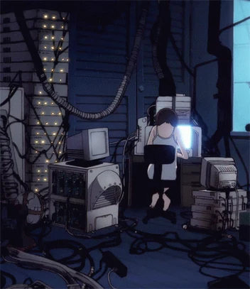 Lain at a keyboard surrounded by CRT monitors, computer towers and cables